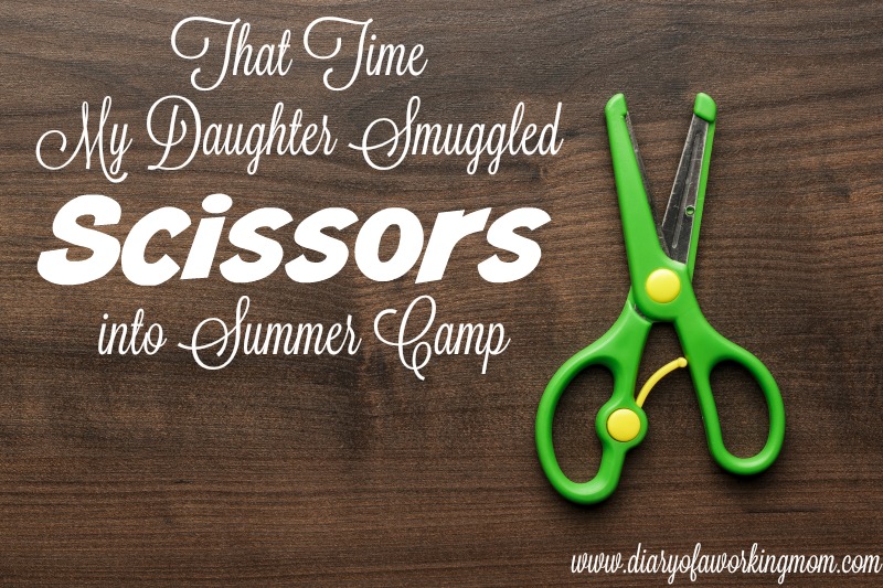 children's scissors on the brown wooden table